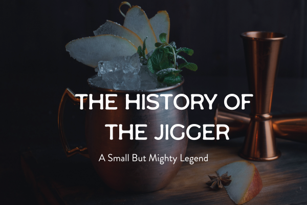Copper jigger next to cocktail