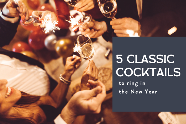 new year's eve party guests toasting with champagne and sparklers