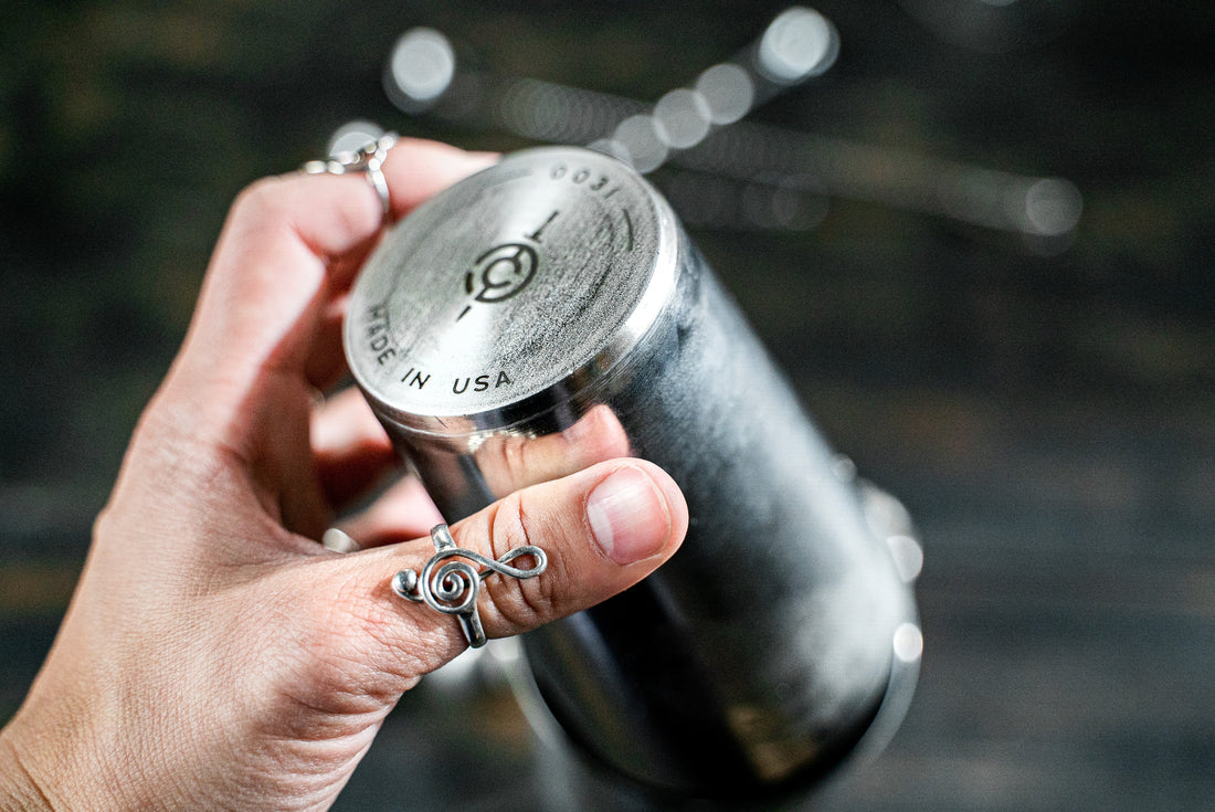 Man's hand holding a C&D Tools Boston cocktail shaker